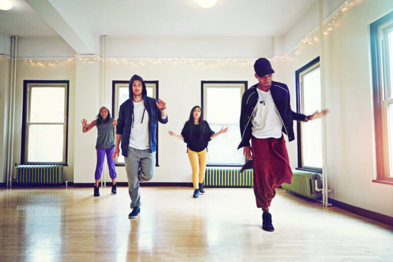 Hip hop dance group practicing in studio